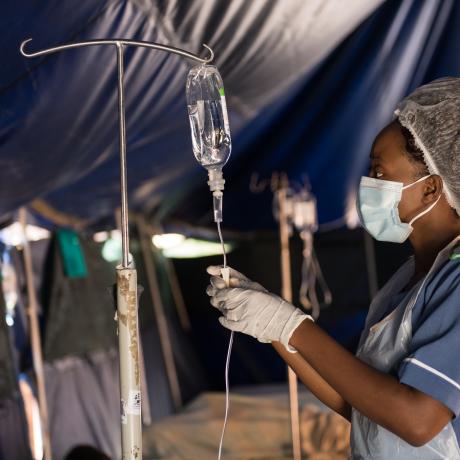 A nurse in Blantyre, Malawi attending to patients in a tent